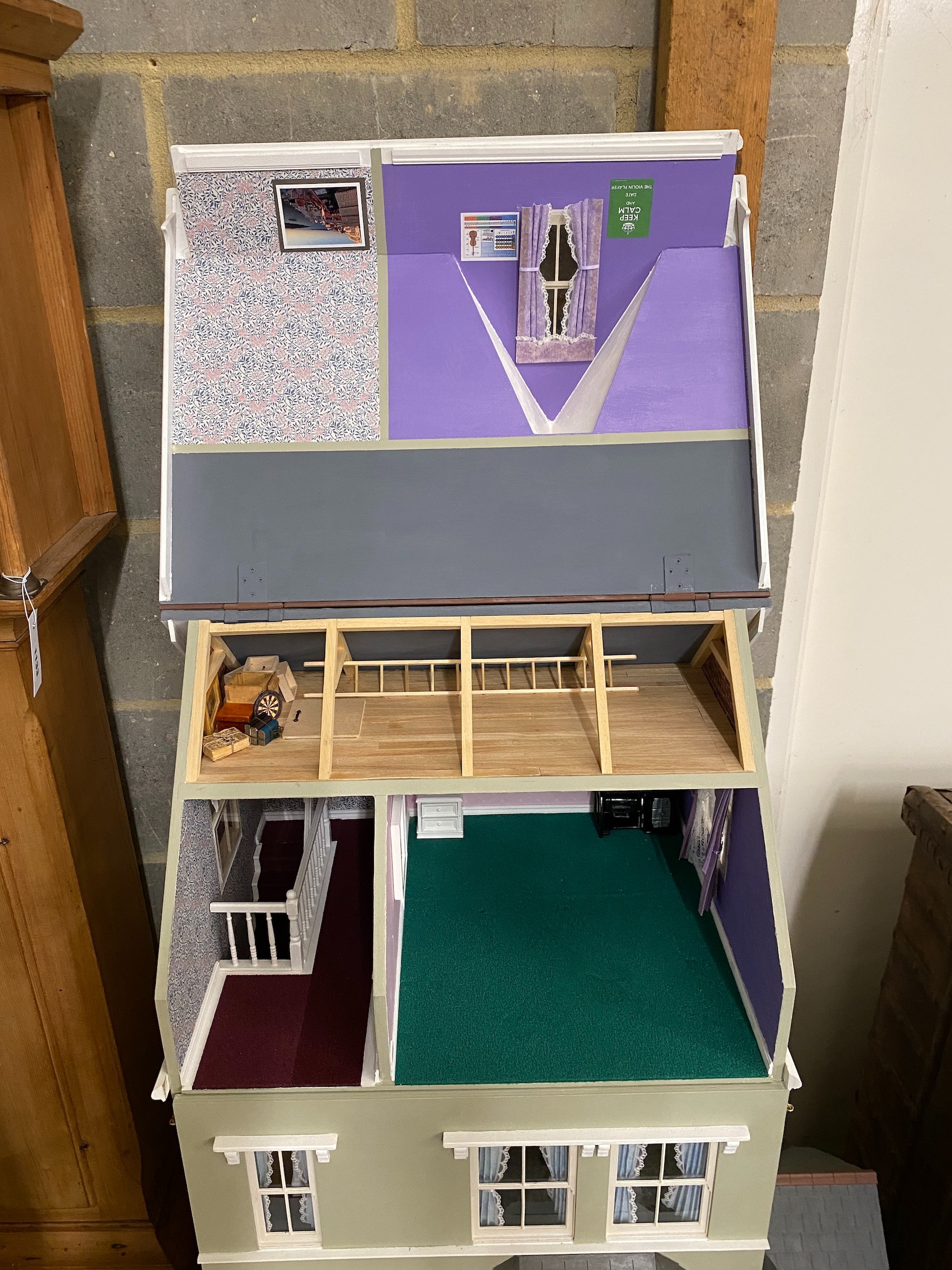 A good quality modern painted wood doll's house, modelled as a Victorian four storey villa, width 76cm, depth 73cm, height 150cm